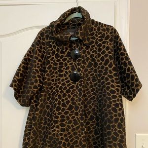 Black and brown Luii coat with quarter length sleeves.